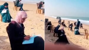 স্কুল-কলেজ ধ্বংস, গাজায় সাগরতীরে বসে পরীক্ষা দিচ্ছেন শিক্ষার্থীরা